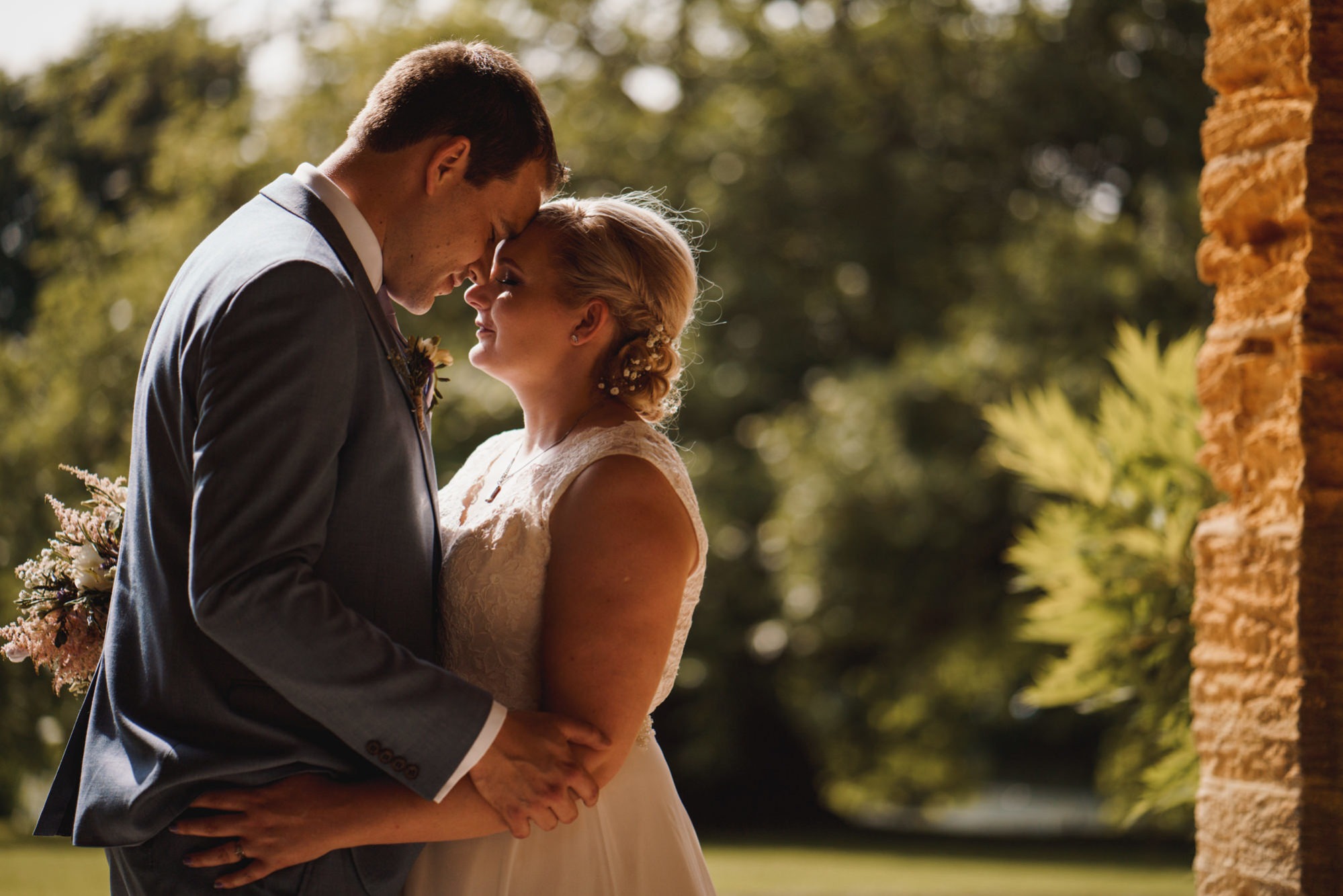 bride and groom face each other in lovely light at stanway house